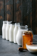 Fresh milk in different glass bottles