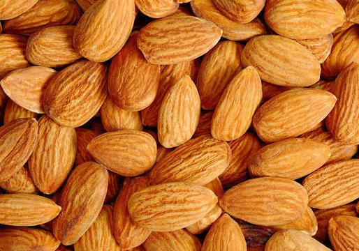 Many almond nuts as background or texture