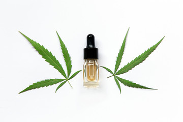 Medicinal cannabis with oil in a bottle on white background.