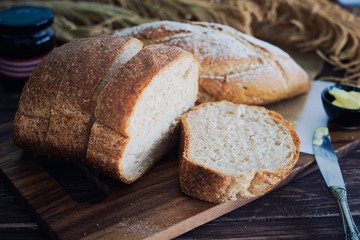 Fresh Bread On Wooden Table.
