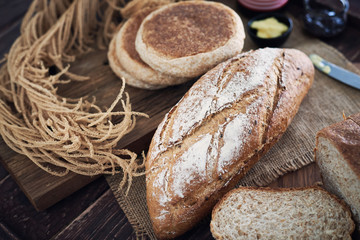 Fresh Bread On Wooden Table.