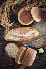 Fresh Bread On Wooden Table.