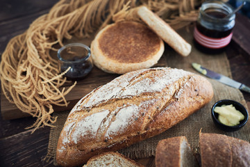 Fresh Bread On Wooden Table.