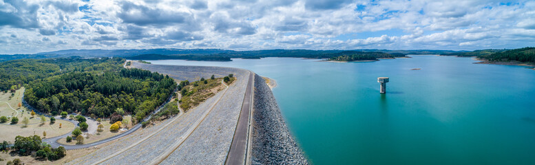 Scenic aerial panorama of Cardinia Reservoir lake and park on overcast day in Melbourne, Australia
