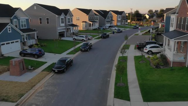 Typical American luxury real estate single family houses on a new construction development street East Coast USA aerial view
