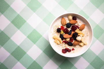Healthy breakfast fresh granola muesli with milk and nuts