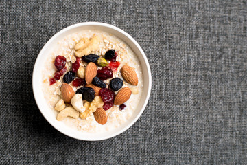 Healthy breakfast fresh granola muesli with milk and nuts
