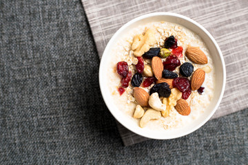 Healthy breakfast fresh granola muesli with milk and nuts