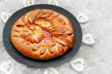 Airy beautiful sweet cake with apple jam on a plate and linen tablecloth
