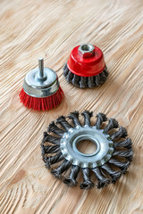 abrasive tools for brushing wood and giving it texture. Wire brushes on treated wood