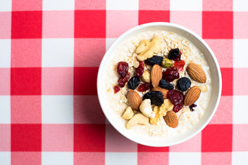 Healthy breakfast fresh granola muesli with milk and nuts