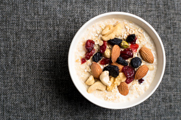 Healthy breakfast fresh granola muesli with milk and nuts
