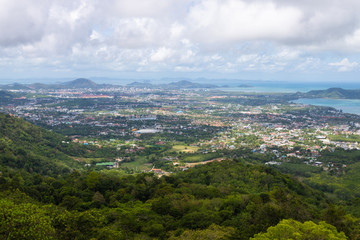 Fototapeta na wymiar Phuket city scape from high hill ground, can see both town and the beach with cloudy sky