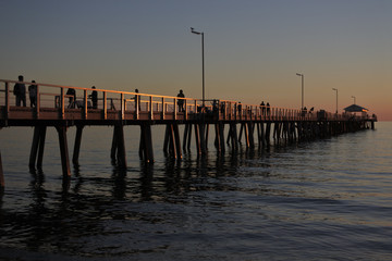 Fototapeta premium Silhouette of Henley Beach pier at dusk in Adelaide South Australia