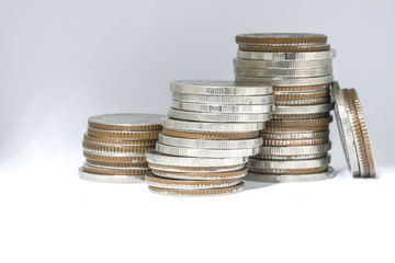 Coin stacks in a row, Euro money, currency. Success, wealth and poverty, poorness concept. Euro coins stack on grey background with copy space.