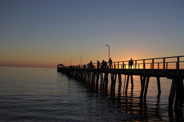 Fototapeta na wymiar Silhouette of Henley Beach pier at dusk in Adelaide South Australia