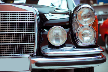 Close-up of headlights of luxurious vintage vehicle