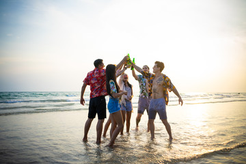 A group of friends who party and play fun on the beach.