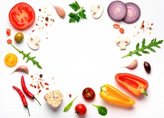 Organic fresh vegetables and spices frame on wooden white background. Copyspace, top view.