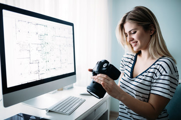 Naklejka premium Young designer working on project at home
