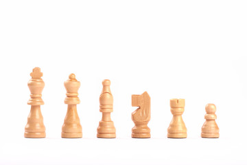 Set of white wooden chess figures in a row isolated on white background