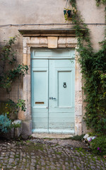 Fototapeta na wymiar Beautiful mint green door in an old French village