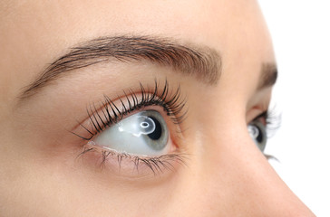 Beautiful young woman after eyelashes lamination, closeup