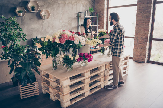 Full length body size photo beautiful she her lady help buy him his he macho guy buy pay perfect composition handmade bunch fresh flowers wife mom gift present holiday small flower shop room indoors