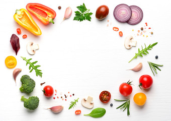 Vegan ingredients for homemade pizza on white wooden background. Top view with copy space.