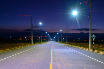 Empty Road at night with Electric Power Light