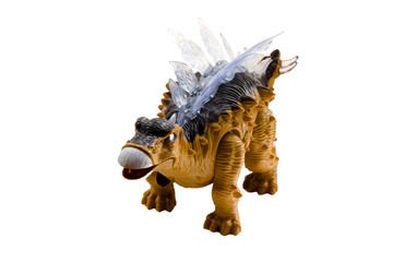 A stegosaurus toy isolated on a white background. © Elena