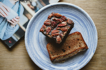 piece of chocolate cake on a plate with fork and knife