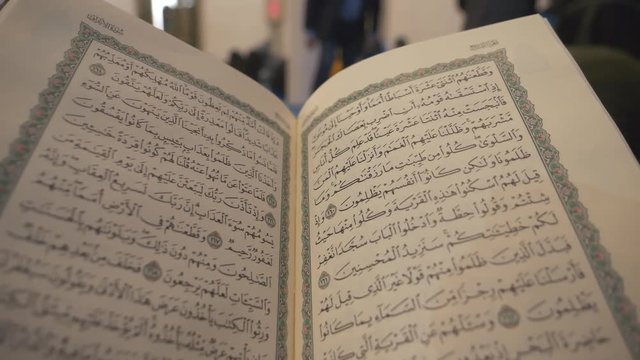 An open Quran book in a mosque.