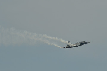A fighter aircraft flying for display
