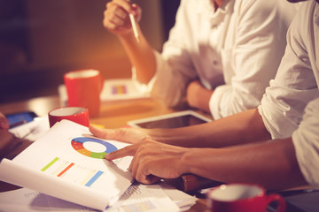 Fototapeta premium Financial advisor, accounting and Investment concept, business owners consult adviser financial meeting to analyze and on the finance report in the his office room.vintage color
