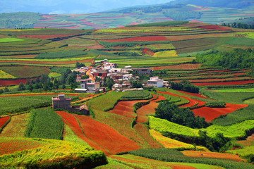 Beautiful country on red dirt and countryside village with mountains at Kunming in Yunnan, China