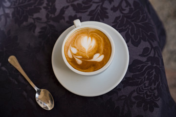 flat lay cappuccino with decoration in milk