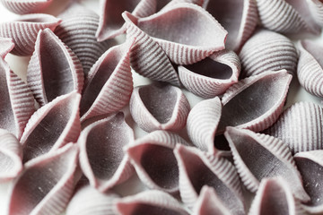 flat lay purple pasta called "conchiglie". For texture or background