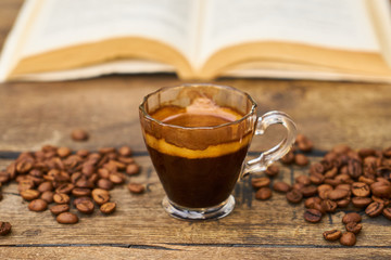 Dark espresso coffee and book