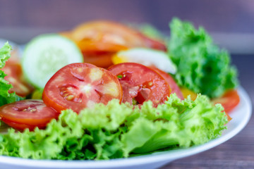 A green salad is a dish consisting of a mixture of small usually Green leafy