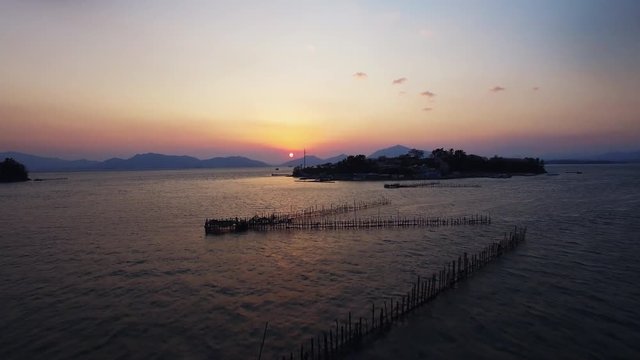 A sunset view of the sea, sacheon sil-an sunset, Korea, wide drone shot