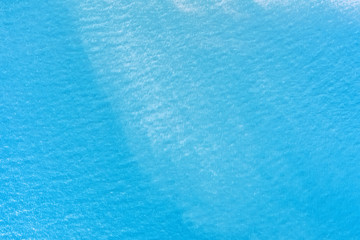 Fototapeta na wymiar Aqua blue calm sea surface aerial view for background