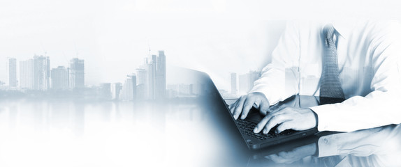 Double exposure of man with city background , he is working concept