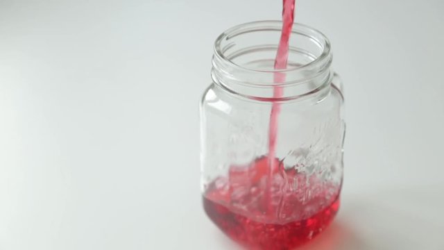 Adding berries and ice to carbonated water. Step by step preparation of cocktails with lemon and orange.