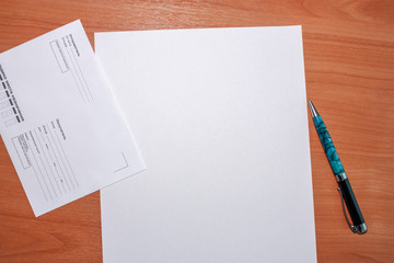 Top view of the mailing envelope with blank fields for the address of the sender and the recipient...