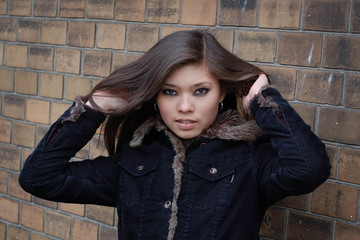 Young attractive asian woman in jacket