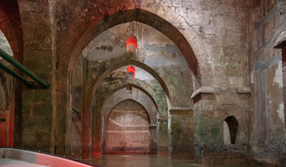 Rowboat at the underground Pool of Arches in Ramla. Israel. Pool built during the reign of the...