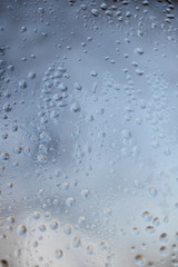 Raindrops on the glass. Depressive abstract background. Summer autumn bad weather