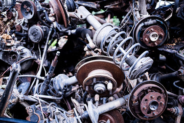 Parts of used cars sitting in junkyard