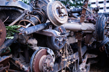 Parts of used cars sitting in junkyard